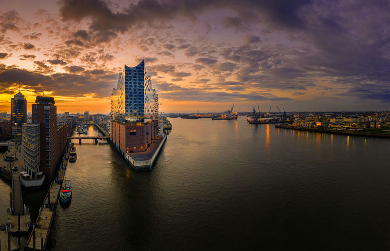 Panoramic view of boats in sea against buildings