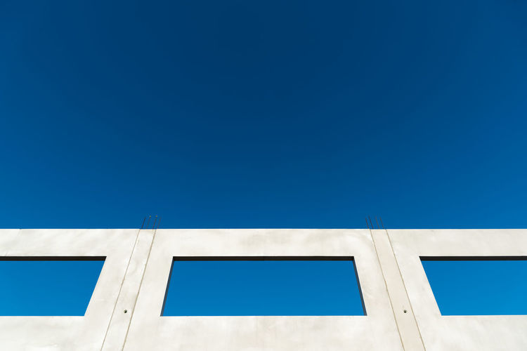 Window of a building shell with blue sky