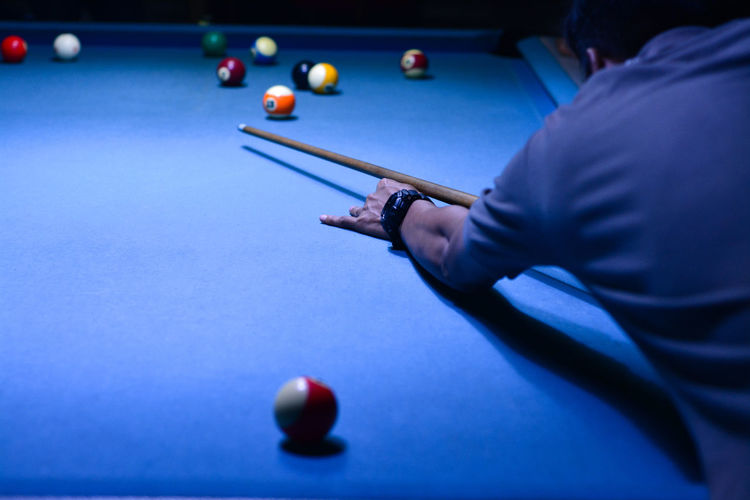 Man playing with ball on table
