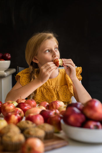 Close-up of girl eating apple