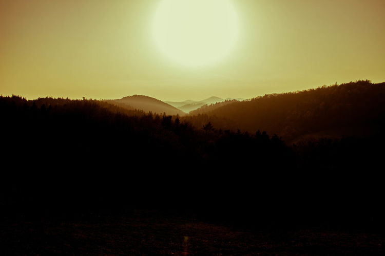 Silhouette of mountain range at sunrise