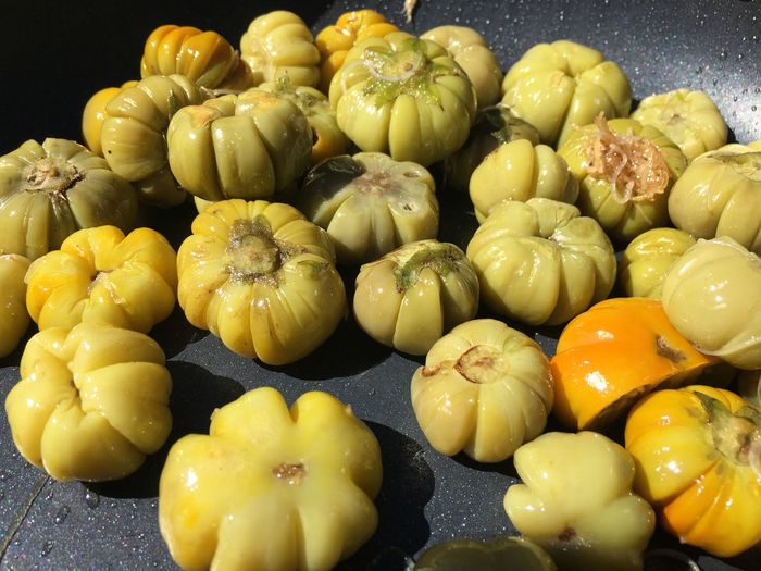 High angle view of fruits and yellow bell peppers