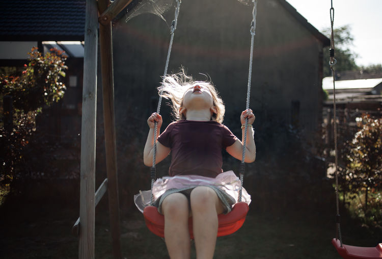 Girl on swing at playground