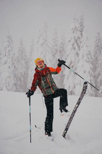 Rear view of man skiing on snow