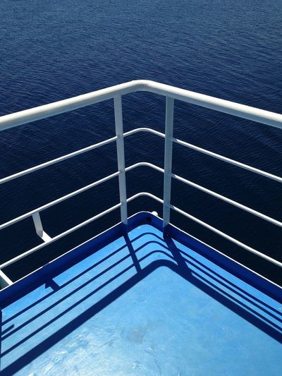 View of railing against blue sky