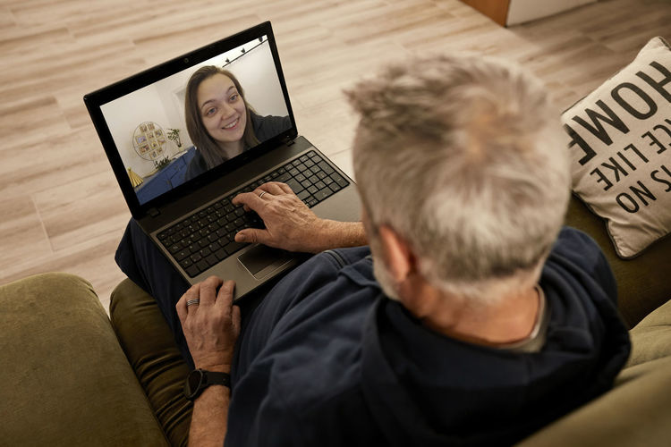 Man doing video call on laptop at home