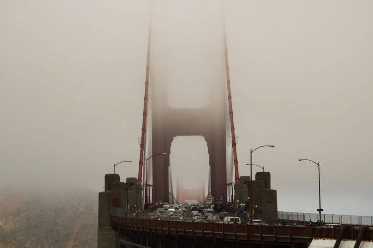 Perspective view of golden gate bridge very crowded under the fog