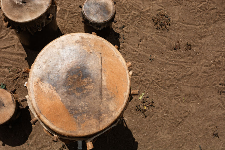 African handmade animal skin drum put on the sunlight to dry.