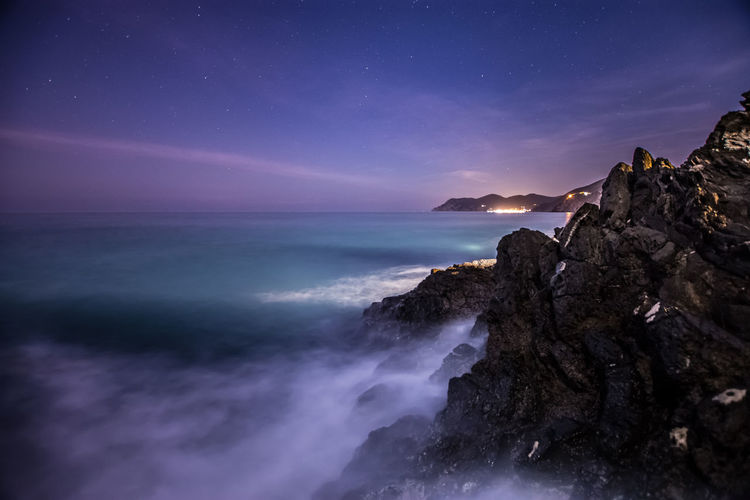 Scenic view of sea against sky at night