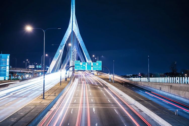 Light trails on leonard p zakim bunker hill bridge at night
