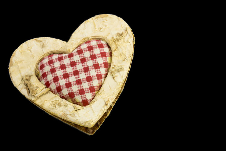 Close-up of heart shape over black background