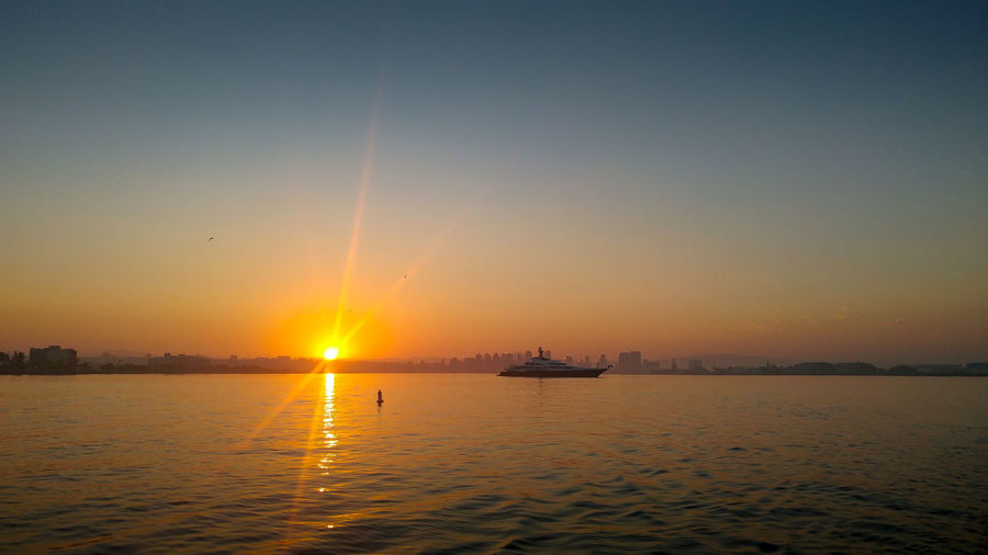 Scenic view of sea against sky during sunset