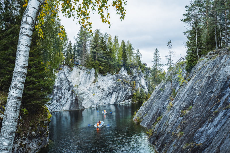 Pleasure boat in marble canyon in the mountain park of ruskeala, karelia, russia