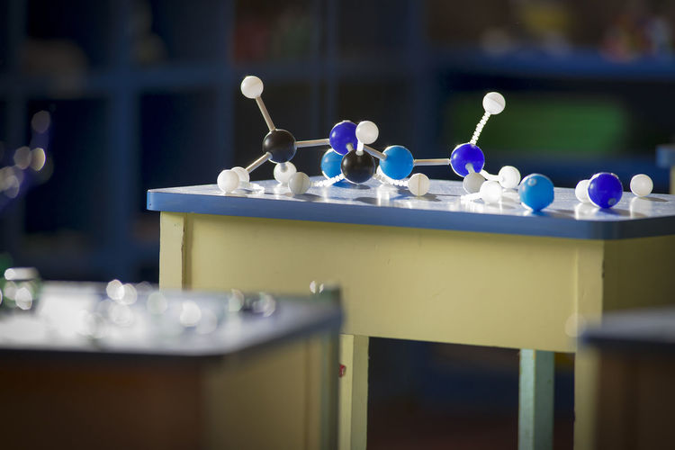 Molecular structure on table in classroom