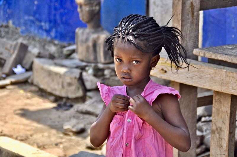Portrait of cute girl standing outdoors