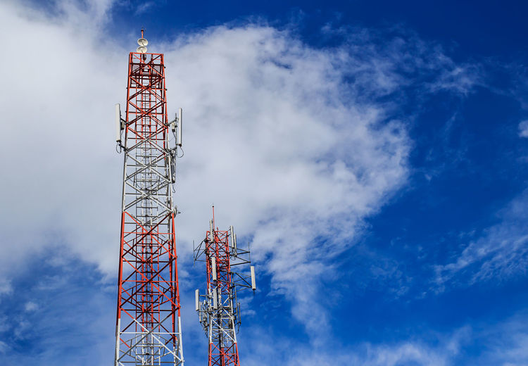 Low angle view of communications tower against sky