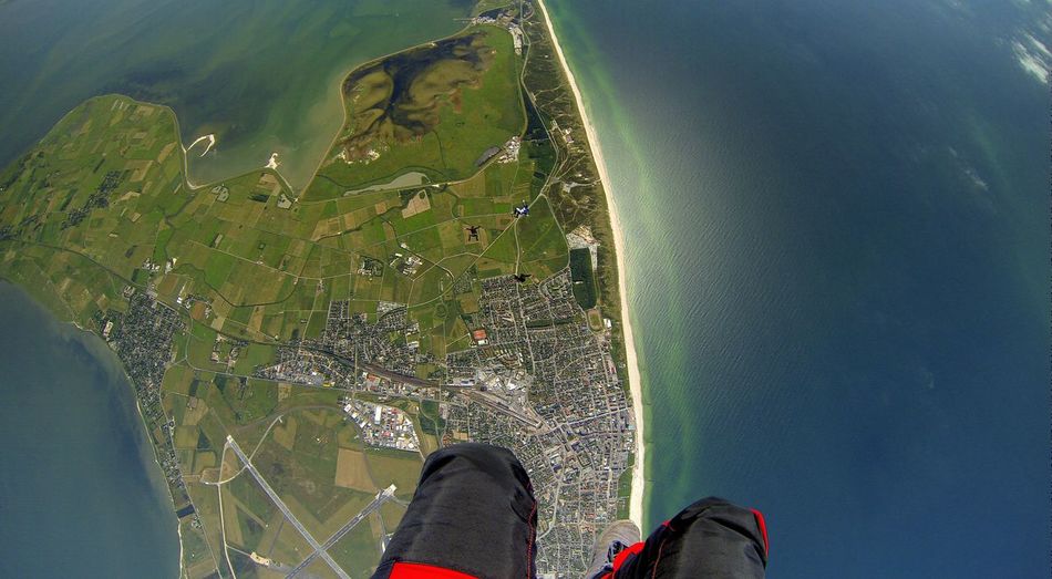 Low section of person skydiving
