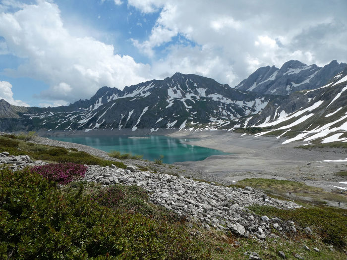 Scenic view of lake and mountains against sky