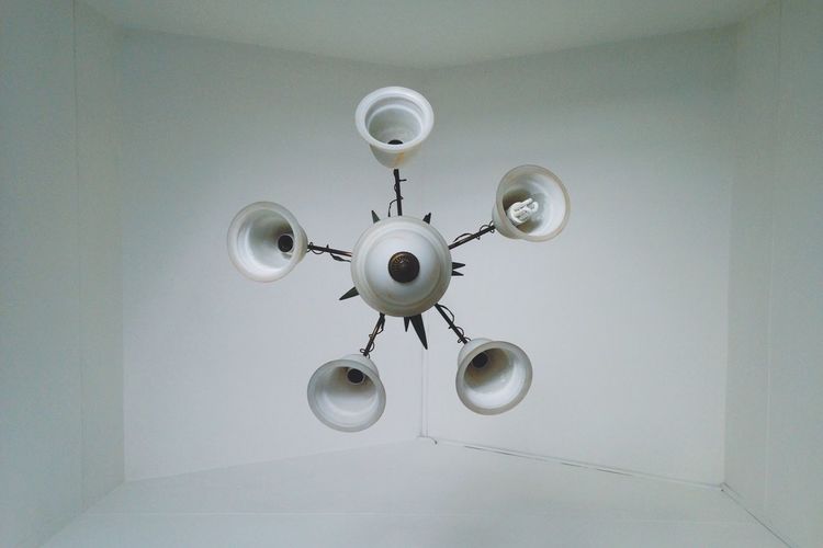 Electric lamp hanging on ceiling