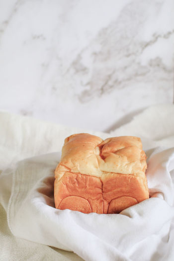 Close-up of bread on bed