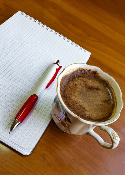 High angle view of coffee cup on table