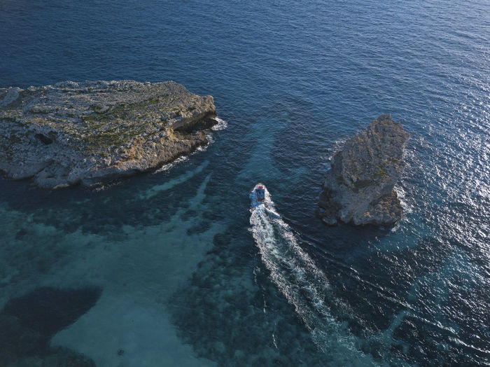 Aerial view of boat sailing in sea