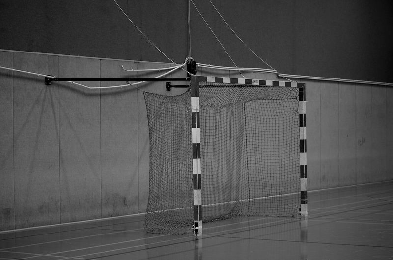 Metallic structure hanging on wall handball goal tor