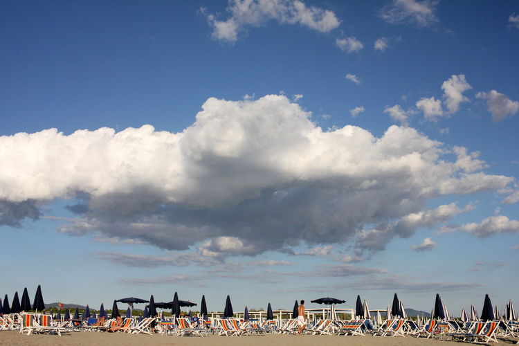 Panoramic view of umbrellas against sky
