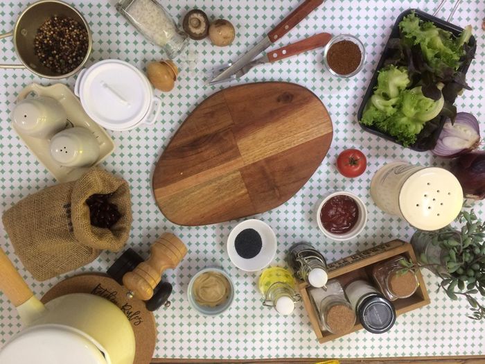 Directly above shot of cutting board and various food on table