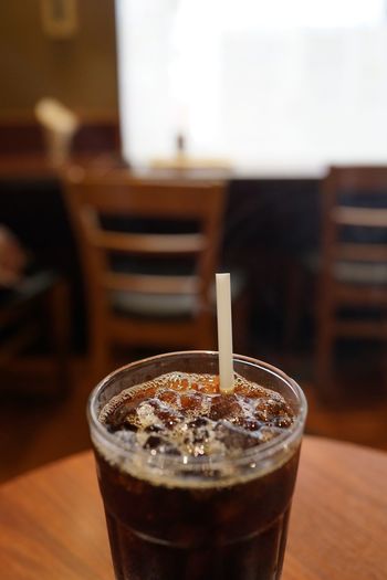Iced coffee in glass on table