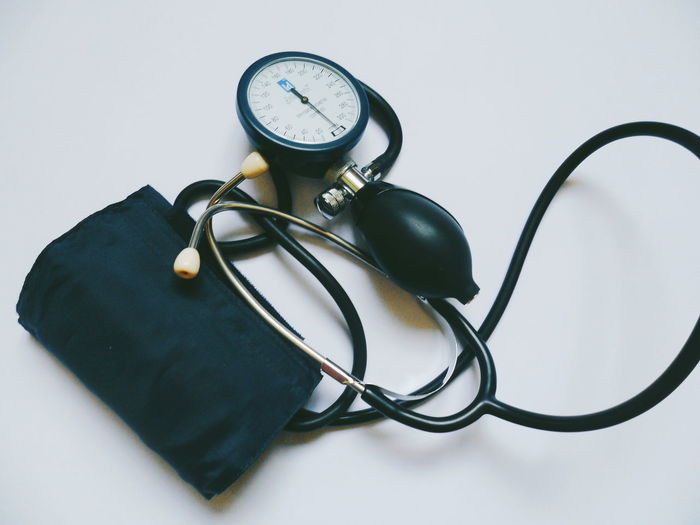 Close-up of blood pressure gauge on table