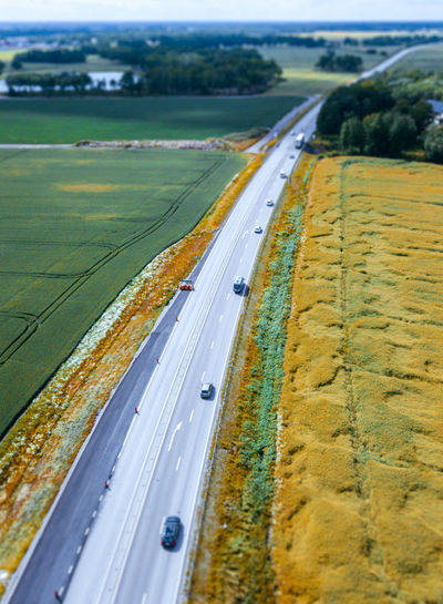 Aerial view of highway leading towards landscape