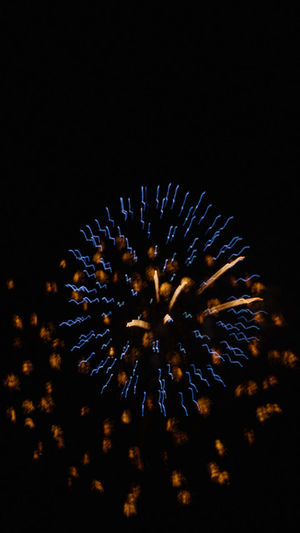 Close-up of firework display against sky at night