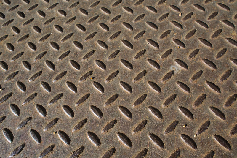 Full frame shot of metal pattern on sand