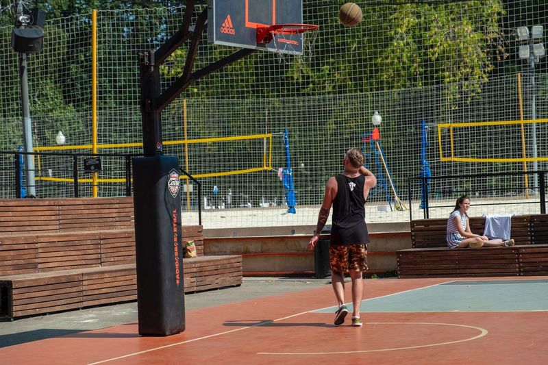 People playing basketball court