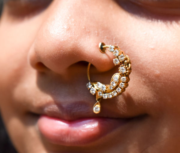 Close-up portrait of girl wearing nose ring