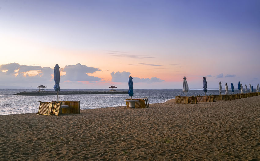 Scenic view of beach against sky during sunset