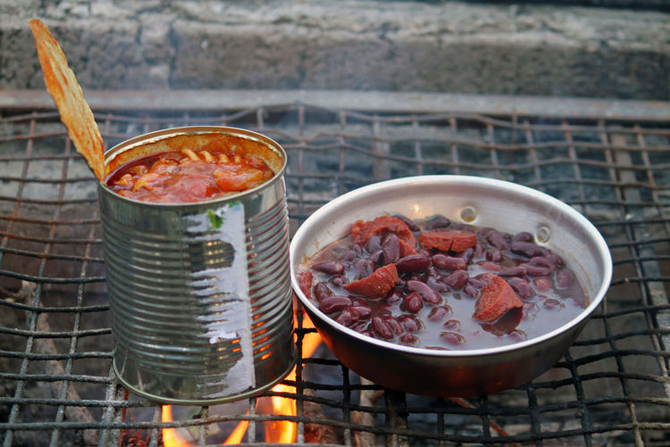 Hearty camping meal - canned pasta and baked beans with sausage