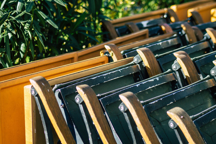 Close-up of chairs arranged outdoors