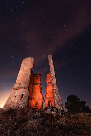 Low angle view of old building at night