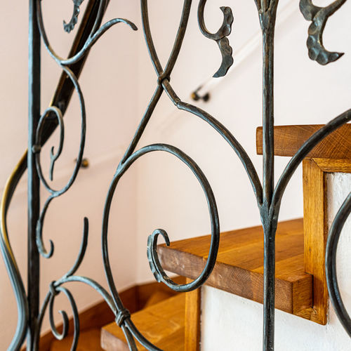 Close-up of railing against wall at home