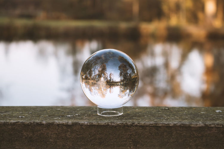 Close-up of crystal ball against water