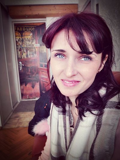 Portrait of smiling woman at home