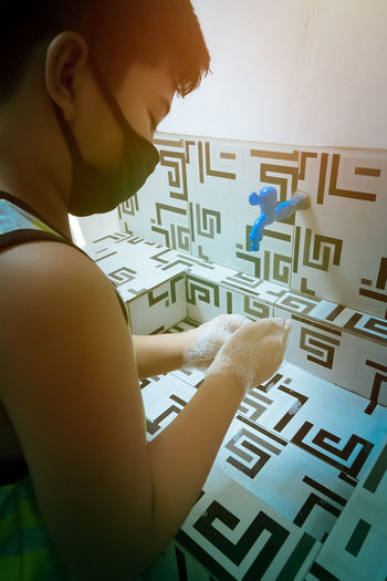 Side view of a boy with text