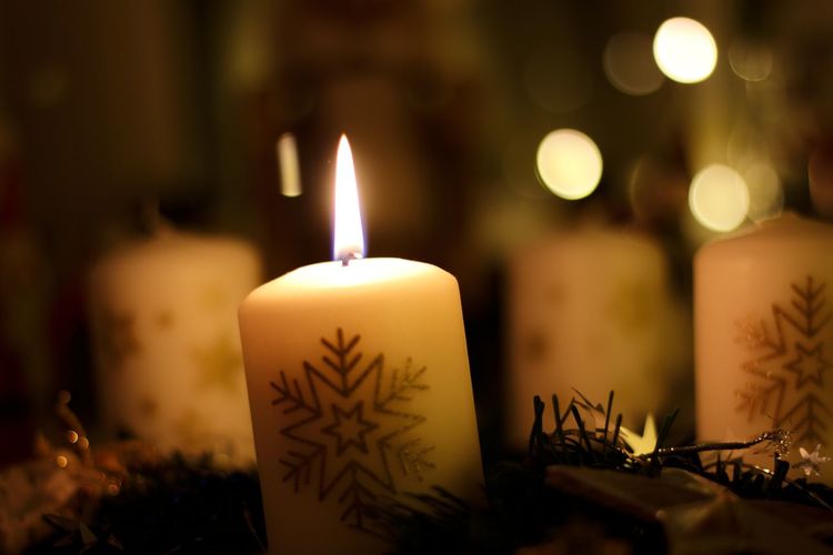 Close-up of illuminated candle