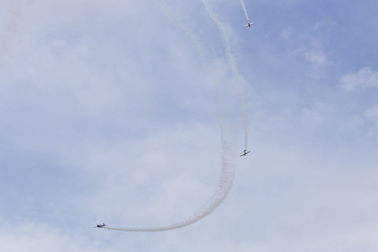 Low angle view of airplane flying in sky