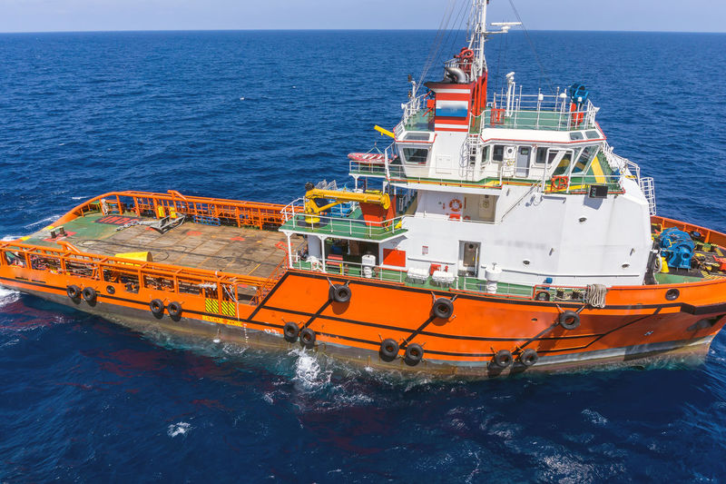 An anchor handling tug boat maneuvering  at offshore terengganu oil field