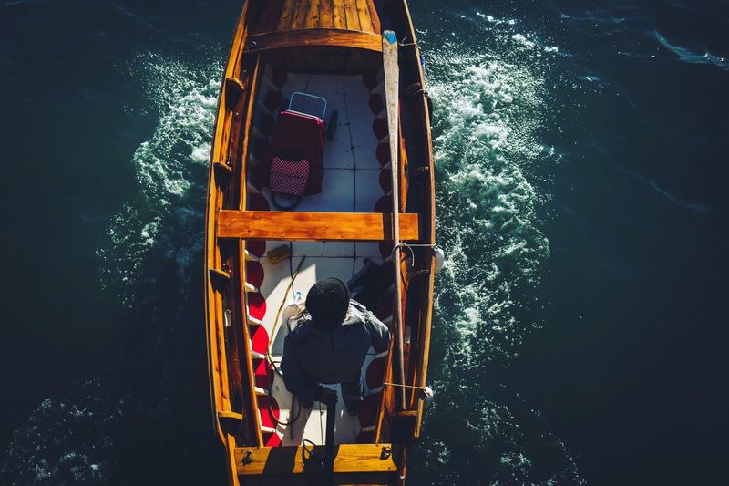 Directly above shot of man sailing on boat in sea