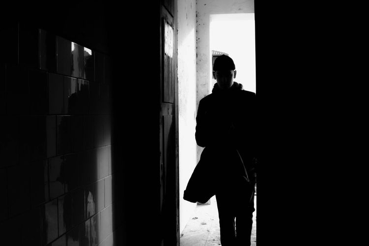 Silhouette woman standing in corridor