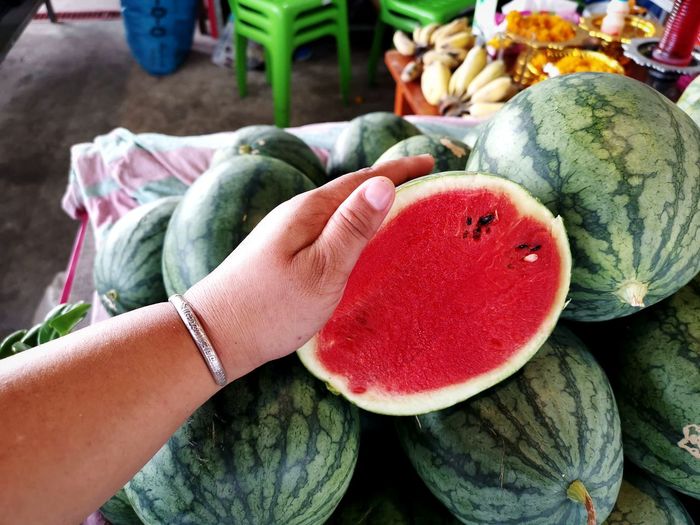 Close-up of hand holding watermelon